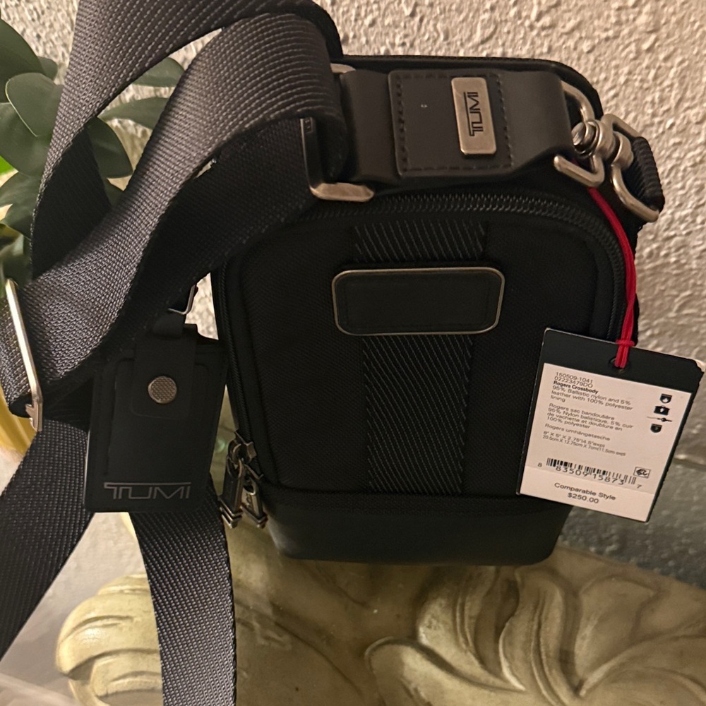 *NEW* TUMI Black crossbody traveling bag.